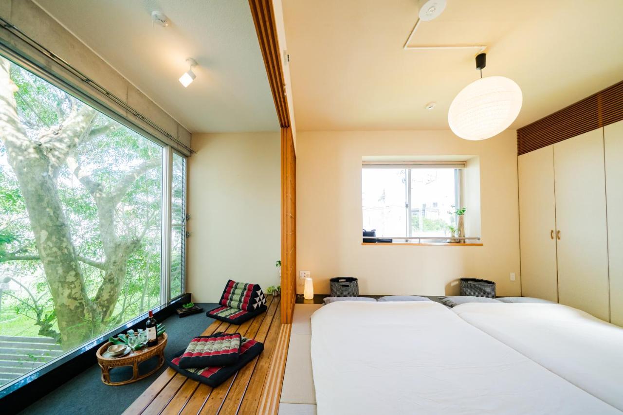 Em Tree House Villa Uruma Exterior foto